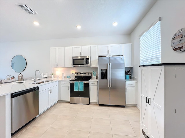 kitchen featuring sink, white cabinets, and stainless steel appliances