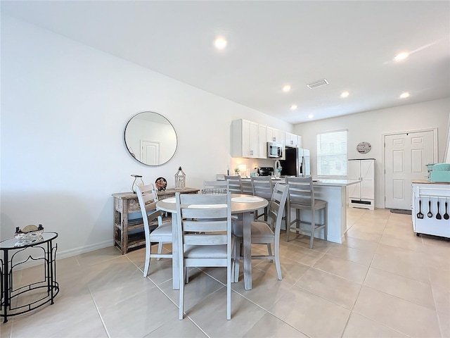 dining space with light tile patterned floors