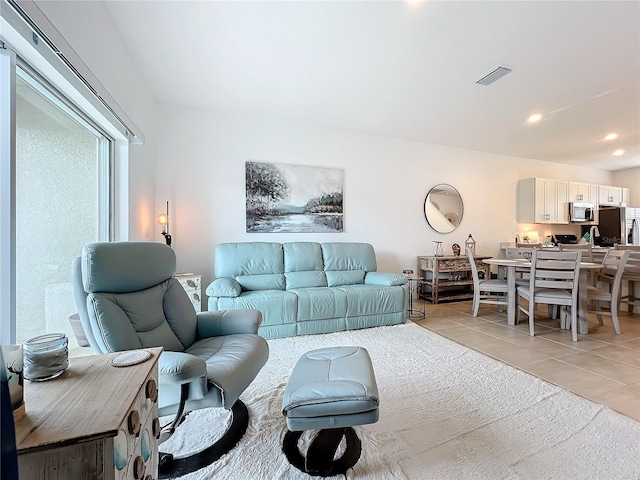 living room with light tile patterned floors