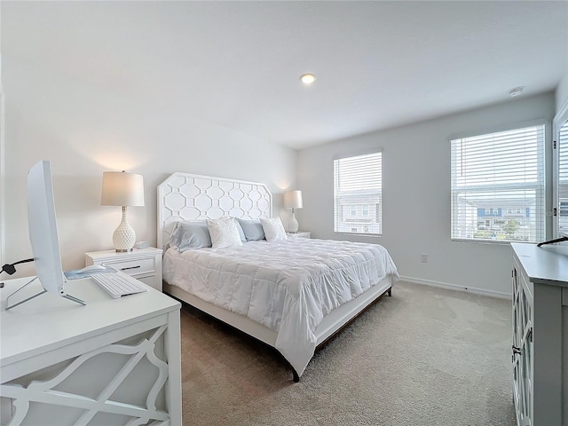 bedroom featuring carpet floors and multiple windows