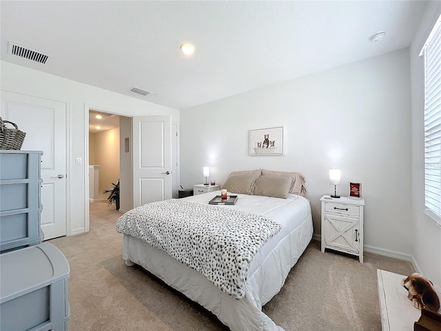 bedroom featuring light colored carpet