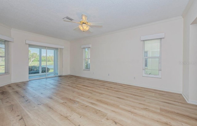 empty room with ceiling fan, crown molding, a textured ceiling, and light hardwood / wood-style flooring