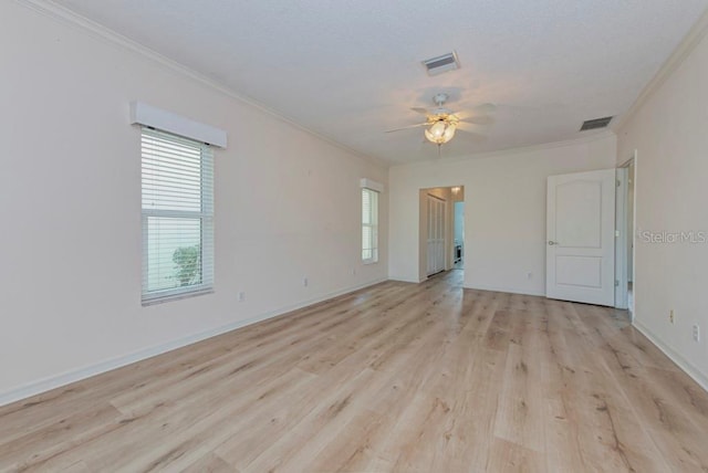 unfurnished room featuring crown molding, light hardwood / wood-style floors, and ceiling fan