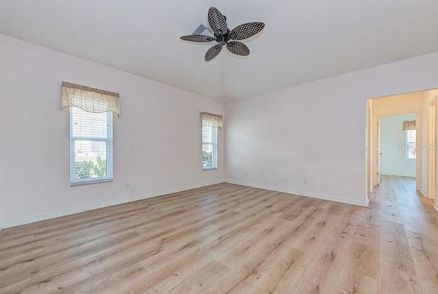 empty room featuring light hardwood / wood-style floors and ceiling fan