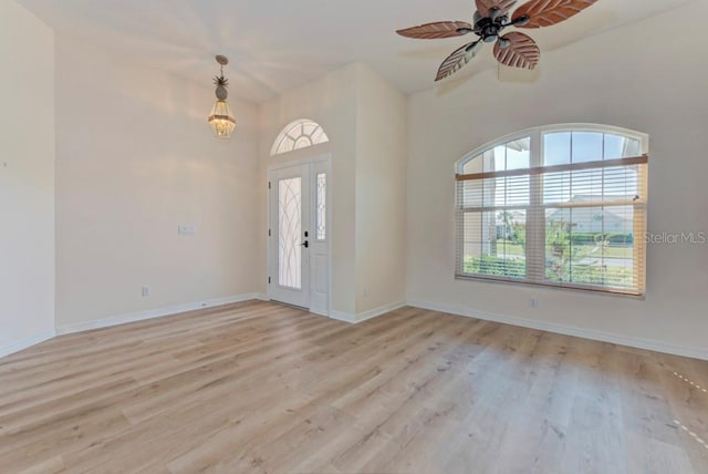 entryway with ceiling fan and light hardwood / wood-style flooring