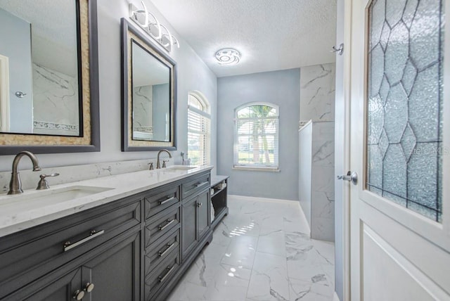 bathroom with vanity and a textured ceiling