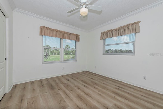 spare room with crown molding, ceiling fan, light hardwood / wood-style flooring, and a textured ceiling