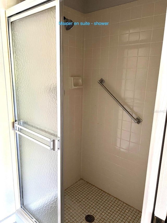 bathroom with an enclosed shower