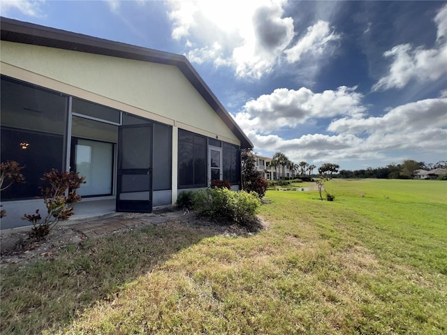 view of yard featuring a sunroom