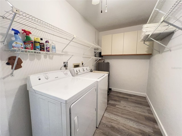 laundry area with laundry area, independent washer and dryer, baseboards, and wood finished floors