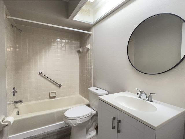 full bath with vanity, wood finished floors, shower / tub combination, and toilet