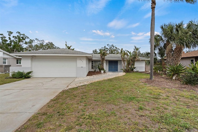 ranch-style home with a front lawn and a garage