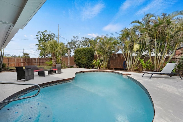 view of swimming pool featuring a patio