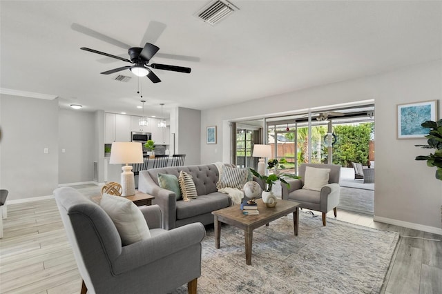 living room featuring ceiling fan and light hardwood / wood-style floors