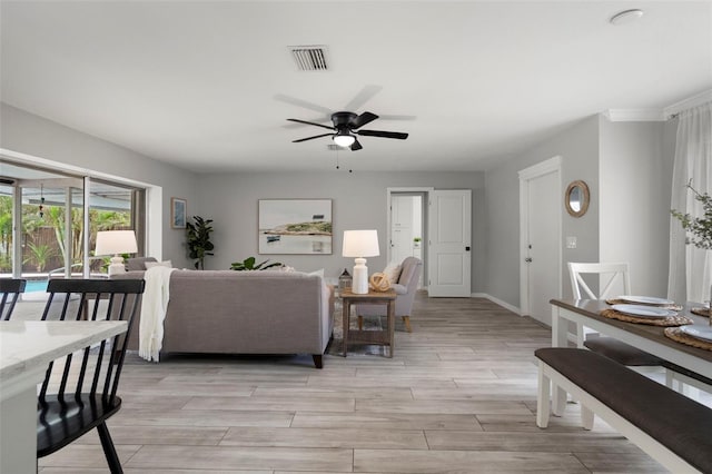 living room featuring ceiling fan