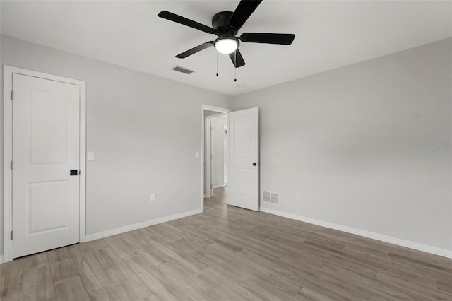 unfurnished room with ceiling fan and light hardwood / wood-style floors