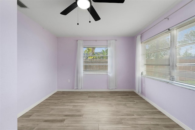 unfurnished room featuring ceiling fan and light hardwood / wood-style floors