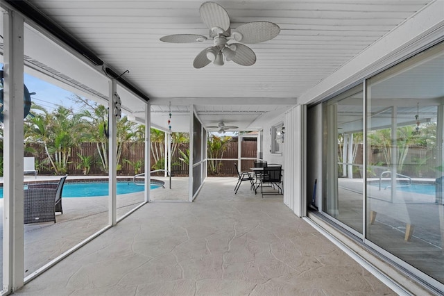 exterior space featuring ceiling fan and plenty of natural light