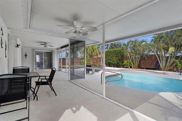 view of swimming pool featuring a patio area and ceiling fan