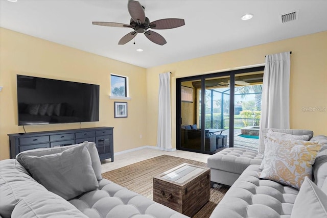 tiled living room with ceiling fan