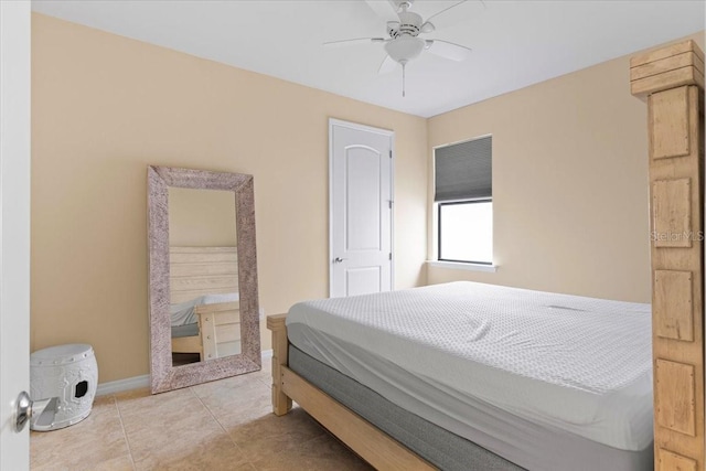 tiled bedroom with ceiling fan