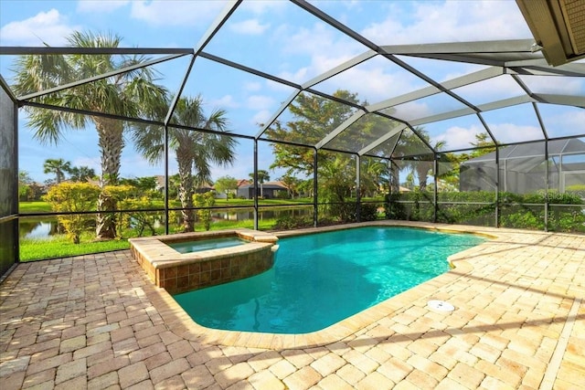 view of swimming pool featuring an in ground hot tub, a water view, and a patio area