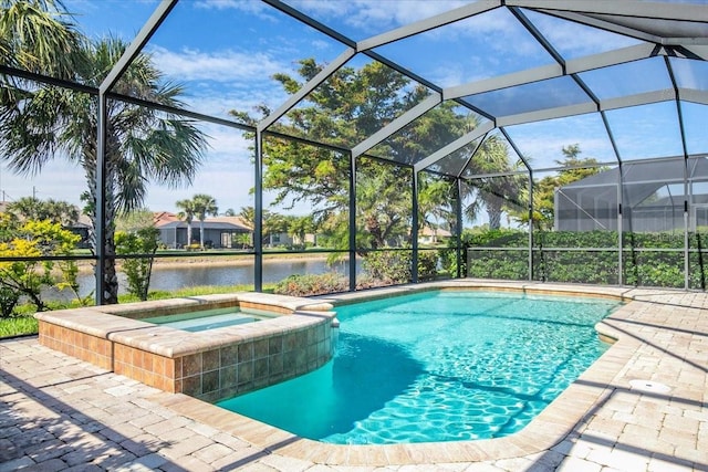 view of pool with glass enclosure, an in ground hot tub, and a water view