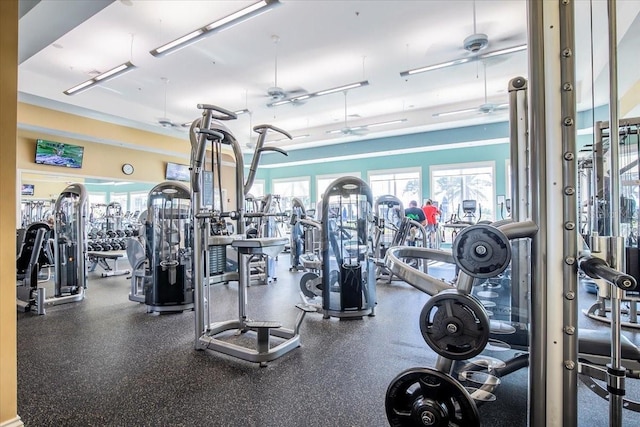 exercise room with ceiling fan