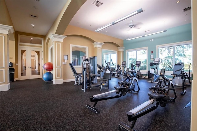 gym with ornate columns and ceiling fan