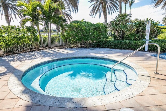 view of swimming pool featuring a community hot tub