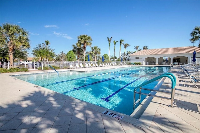 view of swimming pool with a patio area