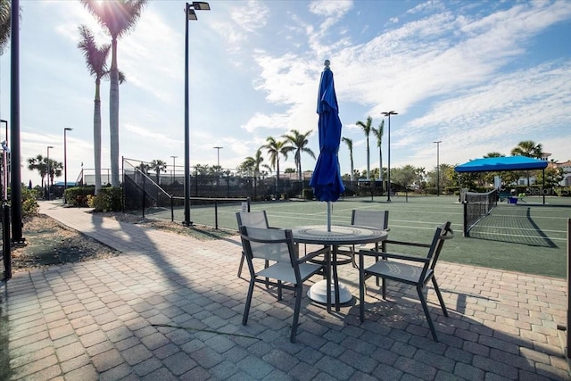 view of patio / terrace featuring tennis court