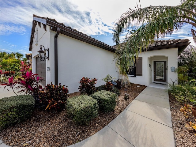 entrance to property featuring a garage