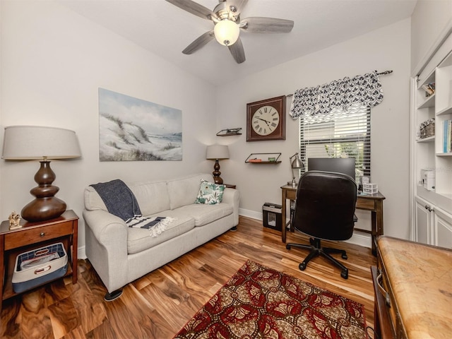 home office with ceiling fan and hardwood / wood-style flooring