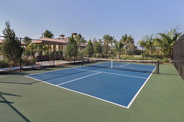 view of sport court with a gazebo and basketball hoop