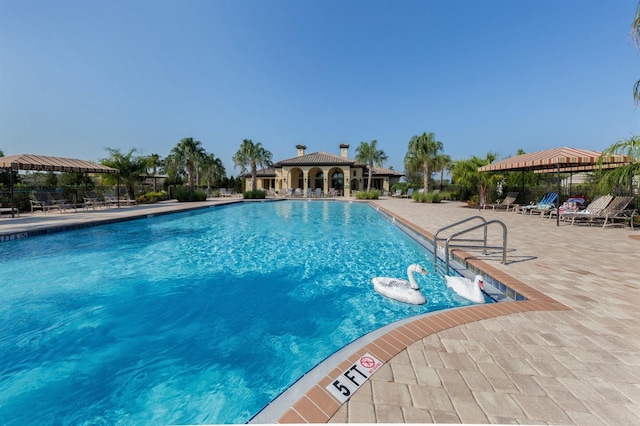 view of pool with a gazebo and a patio