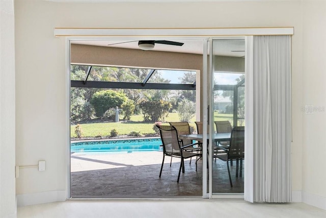 doorway to outside featuring ceiling fan