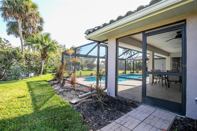 view of patio featuring a lanai