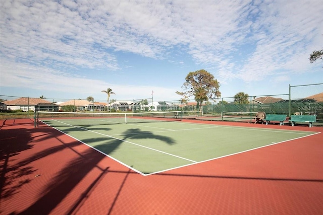 view of tennis court featuring basketball court