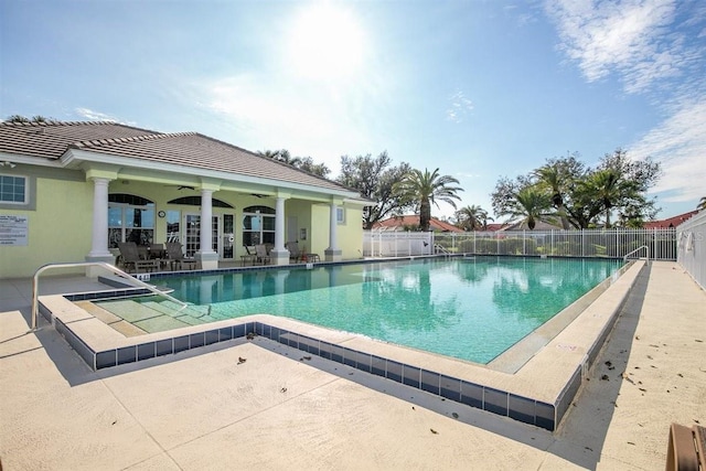 view of pool with a patio area and ceiling fan