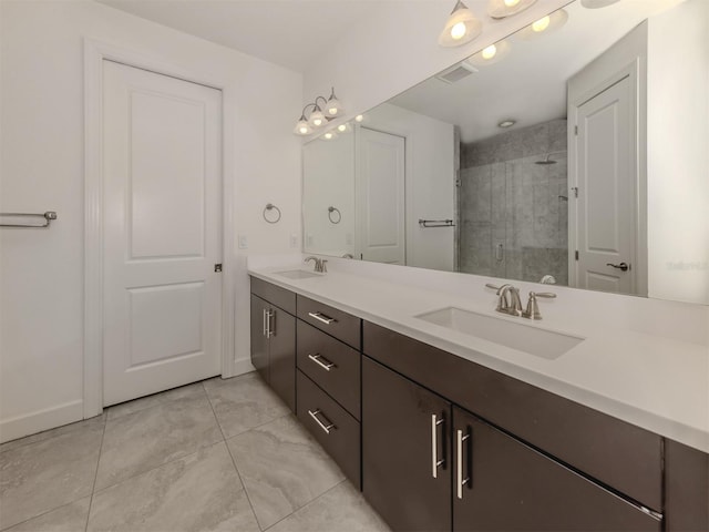 5733 Semolino St, Nokomis, FL 34275 - full bathroom featuring double vanity, a stall shower, baseboards, and tile patterned floors