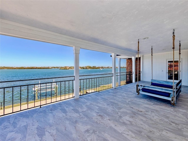 view of patio featuring a water view