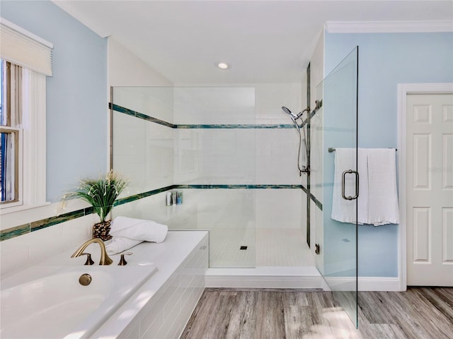 bathroom with plus walk in shower and hardwood / wood-style floors