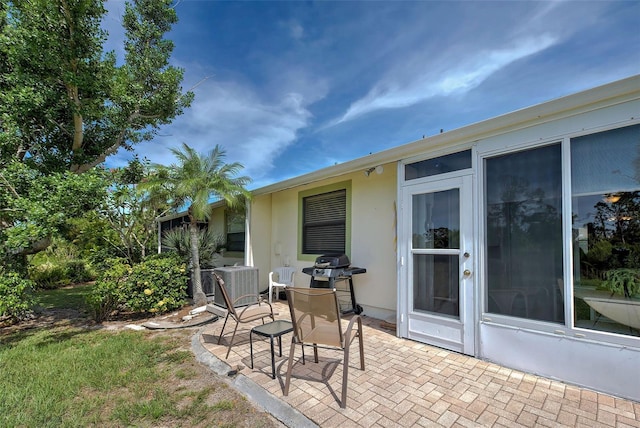 view of patio with grilling area and central AC