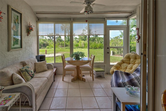 sunroom featuring ceiling fan