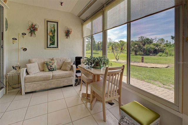 sunroom featuring vaulted ceiling