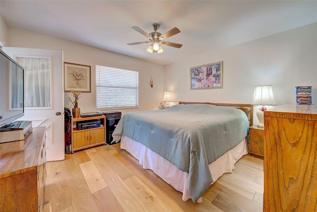 bedroom with ceiling fan and light hardwood / wood-style flooring