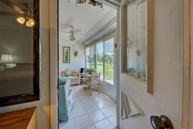 entryway featuring ceiling fan, light tile patterned floors, and wooden ceiling