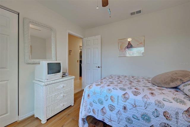 bedroom featuring hardwood / wood-style flooring and ceiling fan