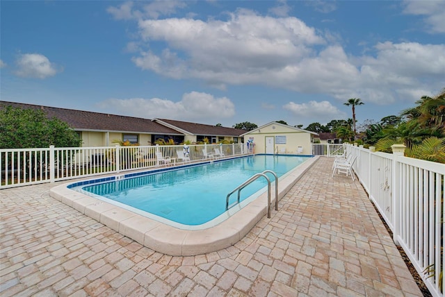 view of swimming pool with a patio